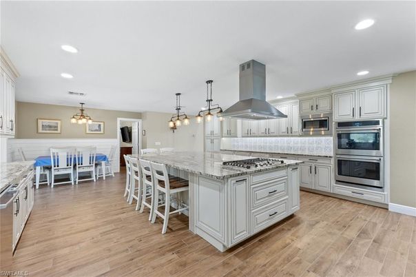 Chandelier, Dining room, Interior, Kitchen, Pendant Lights, Recessed Lighting, Stainless Steel Appliances, Wood Texture Flooring