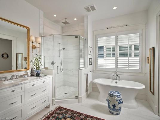 Bathroom, Dual Sink Vanities, Free Standing Baths, Glass Shower, Interior, Marble Walls, Recessed Lighting