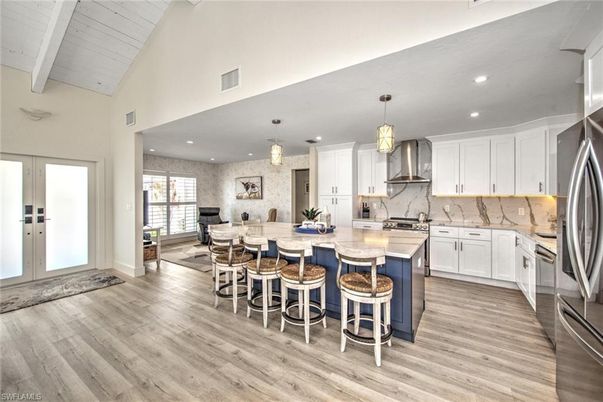 Dining room, Interior, Kitchen, Pendant Lights, Recessed Lighting, Stainless Steel Appliances, Stone Walls, Wood Texture Flooring