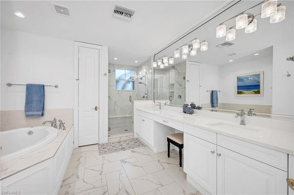 Bathroom, Dual Sink Vanities, Glass Shower, Interior, Marble, Marble Walls, Recessed Lighting