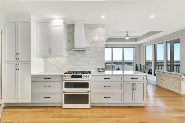 Interior, Kitchen, Marble Walls, Recessed Lighting, Stainless Steel Appliances, Water, Wood Texture Flooring