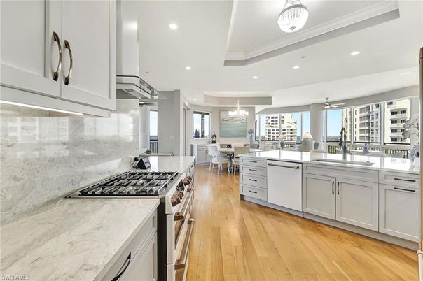 Chandelier, Dining room, Interior, Kitchen, Recessed Lighting, Stainless Steel Appliances, Wood Texture Flooring