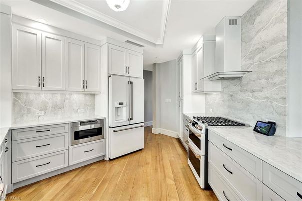 Interior, Kitchen, Marble Walls, Stainless Steel Appliances, Wood Texture Flooring
