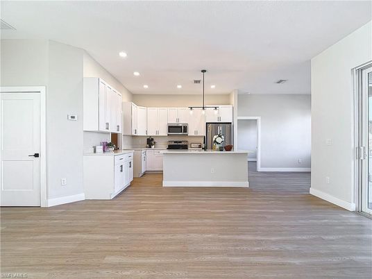 Interior, Kitchen, Pendant Lights, Recessed Lighting, Stainless Steel Appliances, Wood Texture Flooring