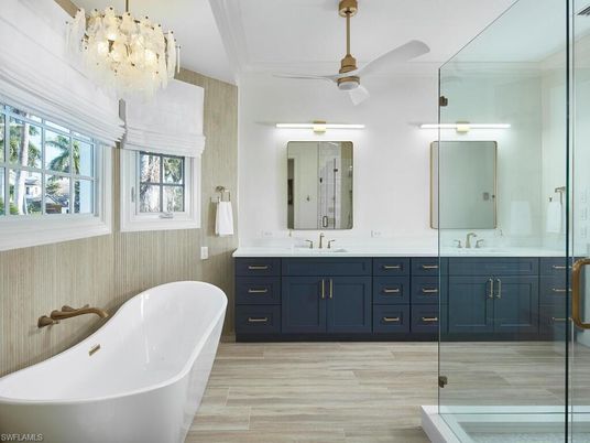Bathroom, Chandelier, Dual Sink Vanities, Free Standing Baths, Glass Shower, Interior, Wood Texture Flooring