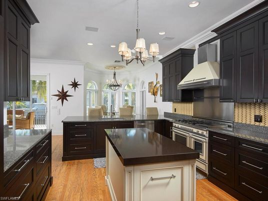 Chandelier, Dining room, Interior, Kitchen, Recessed Lighting, Stainless Steel Appliances, Wood Texture Flooring