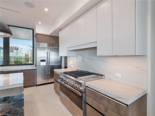 Interior, Kitchen, Marble Walls, Recessed Lighting, Stainless Steel Appliances