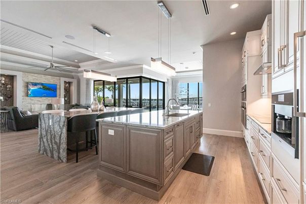 Interior, Kitchen, Living room, Pendant Lights, Recessed Lighting, Stainless Steel Appliances, Stone Walls, Wood Texture Flooring