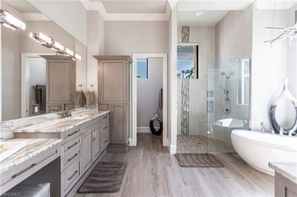 Bathroom, Dual Sink Vanities, Free Standing Baths, Glass Shower, Interior, Recessed Lighting, Wood Texture Flooring