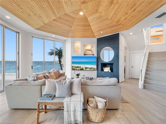 Fireplace, Interior, Living room, Recessed Lighting, Water, Wooden Ceilings, Wood Texture Flooring