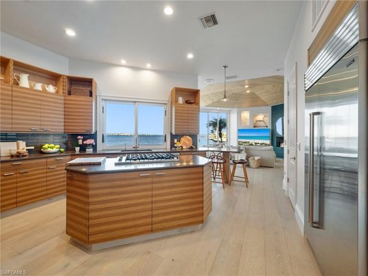 Dining room, Interior, Kitchen, Pendant Lights, Recessed Lighting, Stainless Steel Appliances, Water, Wood Texture Flooring