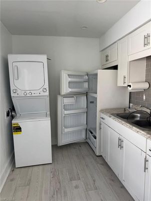 Interior, Recessed Lighting, Utility Closets, Washer, Wood Texture Flooring