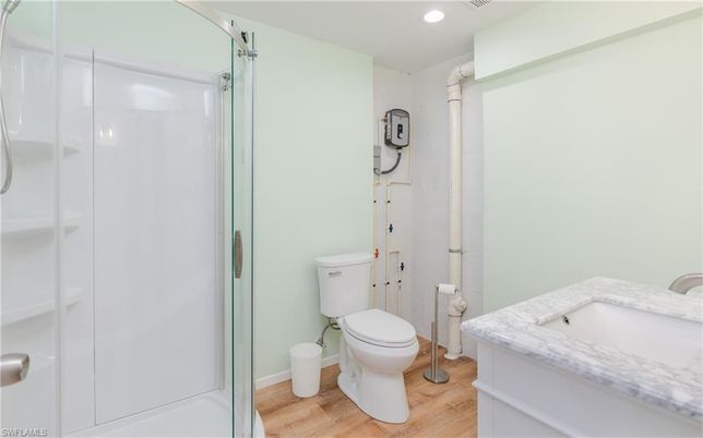 Bathroom, Glass Shower, Interior, Recessed Lighting, Wood Texture Flooring