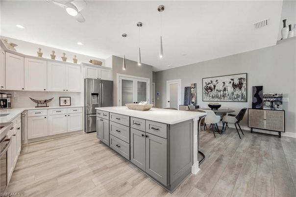 Dining room, Interior, Kitchen, Pendant Lights, Recessed Lighting, Stainless Steel Appliances, Wood Texture Flooring
