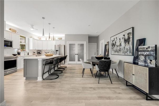 Dining room, Interior, Kitchen, Pendant Lights, Recessed Lighting, Stainless Steel Appliances, Wood Texture Flooring
