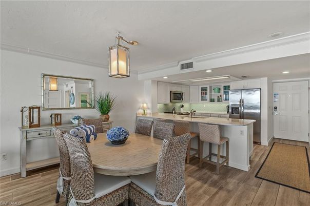 Dining room, Interior, Kitchen, Pendant Lights, Recessed Lighting, Stainless Steel Appliances, Wood Texture Flooring