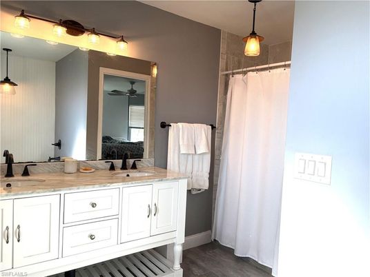 Bathroom, Dual Sink Vanities, Interior, Pendant Lights, Wood Texture Flooring