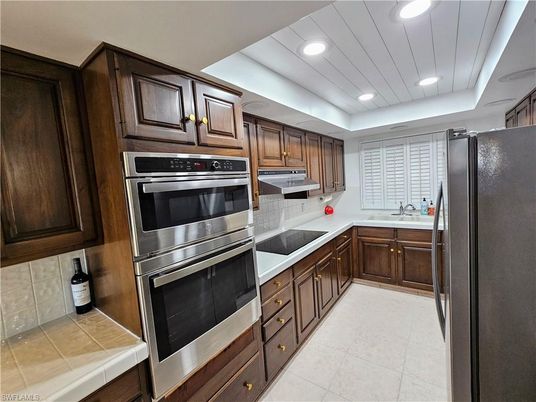 Interior, Kitchen, Recessed Lighting, Stainless Steel Appliances, Tile Countertops