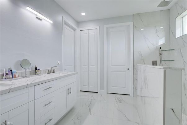 Bathroom, Dual Sink Vanities, Glass Shower, Interior, Marble, Marble Walls, Recessed Lighting