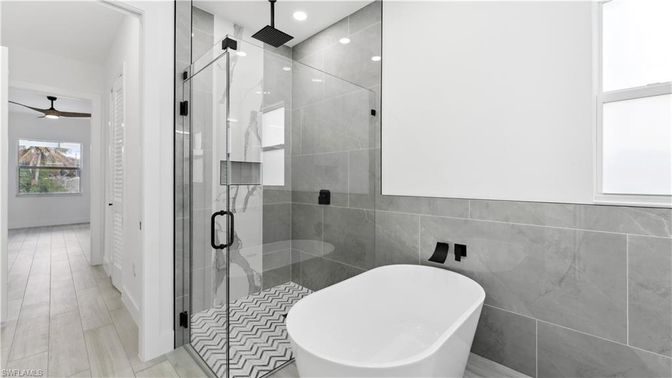 Bathroom, Free Standing Baths, Glass Shower, Interior, Recessed Lighting, Wood Texture Flooring