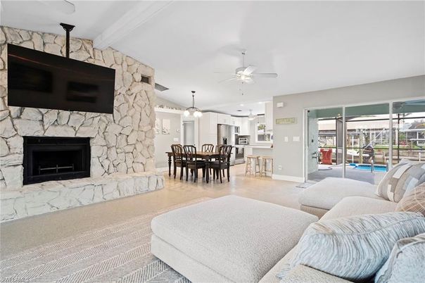 Dining room, Fireplace, Interior, Kitchen, Living room, Pendant Lights, Stainless Steel Appliances, Stone Walls