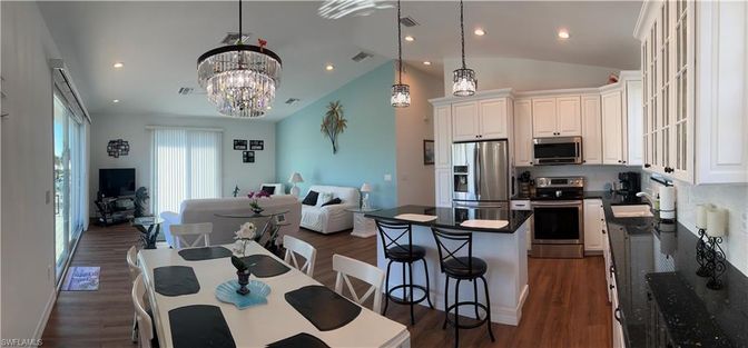 Chandelier, Dining room, Interior, Kitchen, Living room, Pendant Lights, Recessed Lighting, Stainless Steel Appliances, Wood Texture Flooring