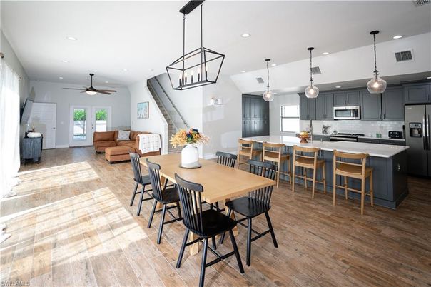 Dining room, Interior, Kitchen, Living room, Pendant Lights, Recessed Lighting, Stainless Steel Appliances, Wood Texture Flooring