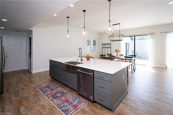Dining room, Interior, Kitchen, Pendant Lights, Recessed Lighting, Stainless Steel Appliances, Wood Texture Flooring