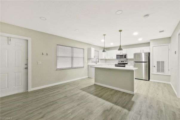 Interior, Kitchen, Pendant Lights, Recessed Lighting, Stainless Steel Appliances, Wood Texture Flooring