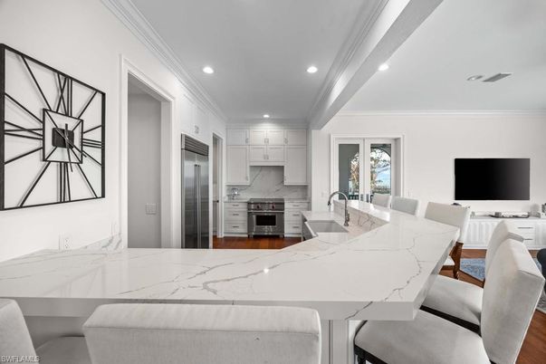 Dining room, Interior, Kitchen, Recessed Lighting, Stainless Steel Appliances, Wood Texture Flooring