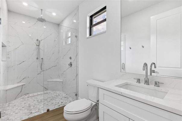 Bathroom, Glass Shower, Interior, Marble Walls, Recessed Lighting, Wood Texture Flooring