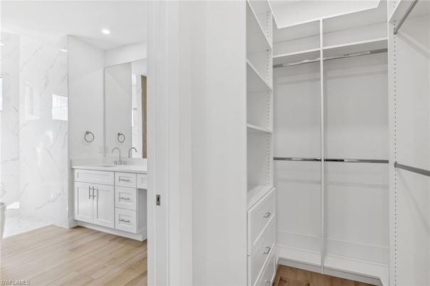 Bathroom, Interior, Marble Walls, Recessed Lighting, Walk-in Closets, Wood Texture Flooring