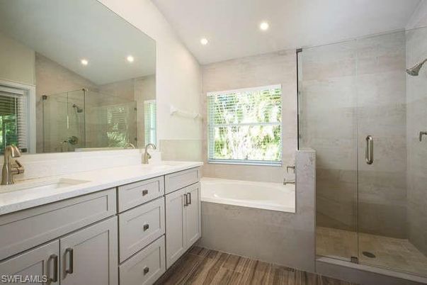 Bathroom, Dual Sink Vanities, Glass Shower, Interior, Recessed Lighting, Wood Texture Flooring