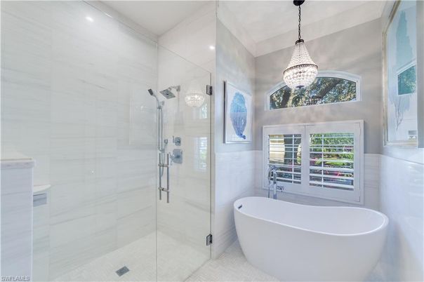 Bathroom, Chandelier, Free Standing Baths, Glass Shower, Interior, Pendant Lights, Recessed Lighting