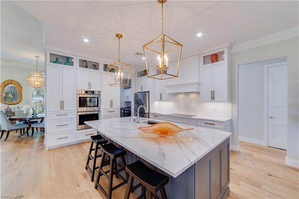 Chandelier, Dining room, Interior, Kitchen, Pendant Lights, Recessed Lighting, Stainless Steel Appliances, Wood Texture Flooring