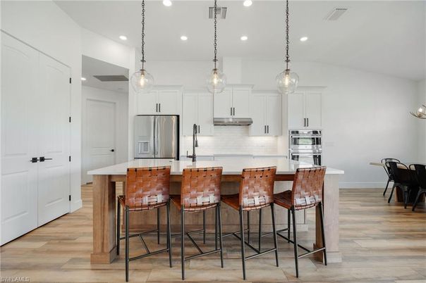 Interior, Kitchen, Pendant Lights, Recessed Lighting, Stainless Steel Appliances, Wood Texture Flooring