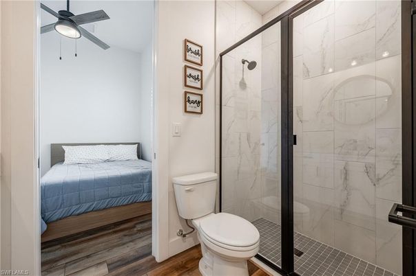 Bathroom, Bedroom, Glass Shower, Interior, Marble Walls, Wood Texture Flooring