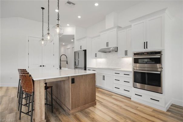 Interior, Kitchen, Pendant Lights, Recessed Lighting, Stainless Steel Appliances, Wood Texture Flooring