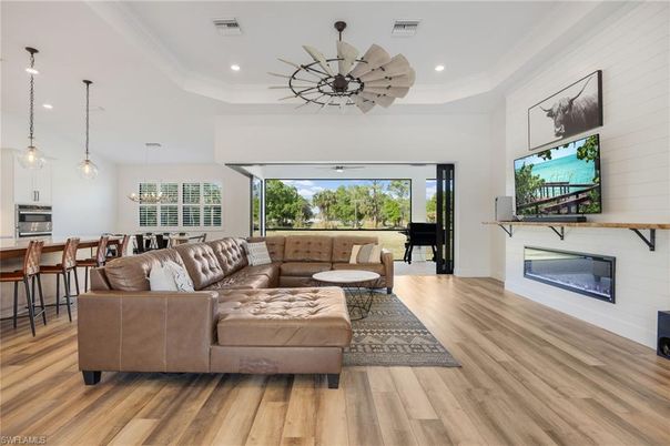 Dining room, Fireplace, Interior, Kitchen, Living room, Pendant Lights, Recessed Lighting, Wood Texture Flooring