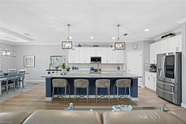 Dining room, Interior, Kitchen, Pendant Lights, Recessed Lighting, Stainless Steel Appliances, Wood Texture Flooring