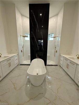 Bathroom, Free Standing Baths, Glass Shower, Interior, Marble, Marble Walls, Recessed Lighting