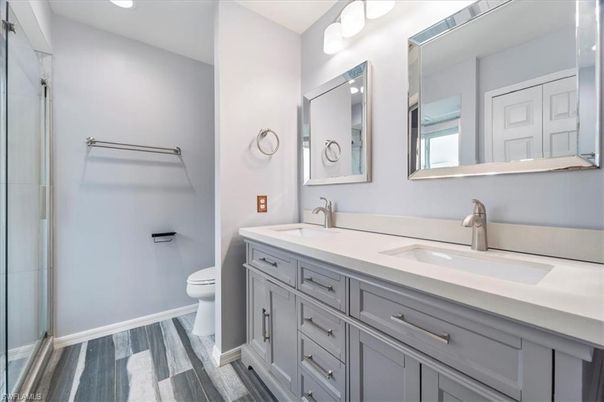 Bathroom, Dual Sink Vanities, Interior, Recessed Lighting, Wood Texture Flooring