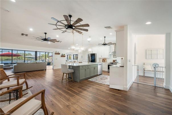 Dining room, Interior, Kitchen, Living room, Pendant Lights, Recessed Lighting, Stainless Steel Appliances, Wood Texture Flooring