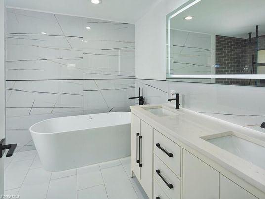 Bathroom, Dual Sink Vanities, Free Standing Baths, Interior, Marble, Marble Walls, Recessed Lighting