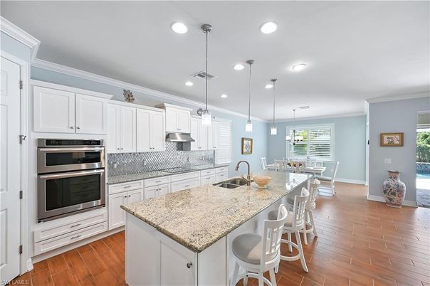 Dining room, Interior, Kitchen, Pendant Lights, Recessed Lighting, Stainless Steel Appliances, Wood Texture Flooring