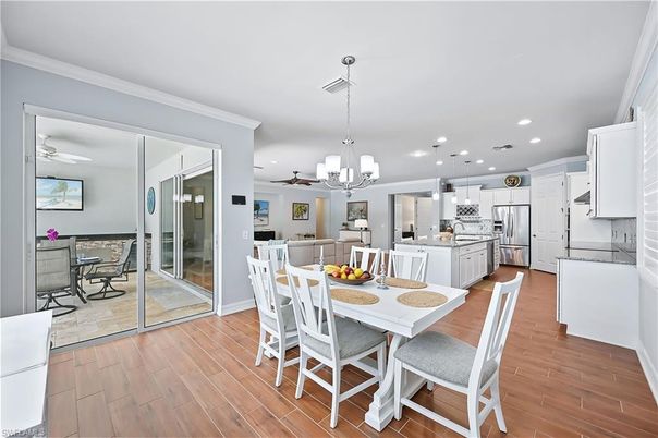 Dining room, Interior, Kitchen, Pendant Lights, Recessed Lighting, Stainless Steel Appliances, Wood Texture Flooring