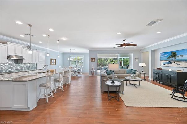 Dining room, Interior, Kitchen, Living room, Pendant Lights, Recessed Lighting, Stainless Steel Appliances, Wood Texture Flooring