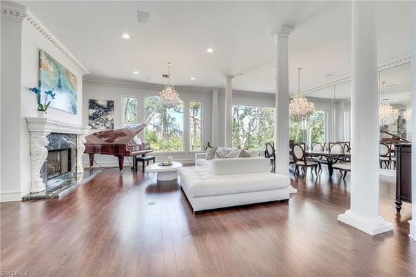 Chandelier, Dining room, Fireplace, Interior, Living room, Piano, Recessed Lighting, Wood Texture Flooring