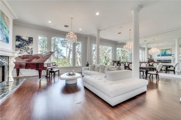 Chandelier, Dining room, Fireplace, Interior, Living room, Piano, Recessed Lighting, Wood Texture Flooring