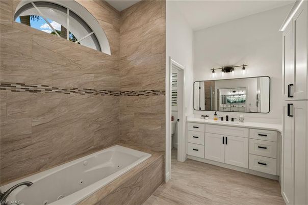 Bathroom, Dual Sink Vanities, Interior, Marble Walls, Wood Texture Flooring